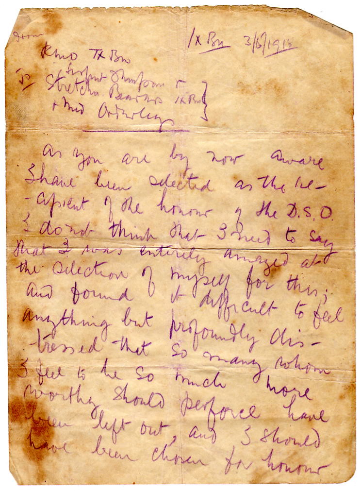 A handwritten letter on aged paper